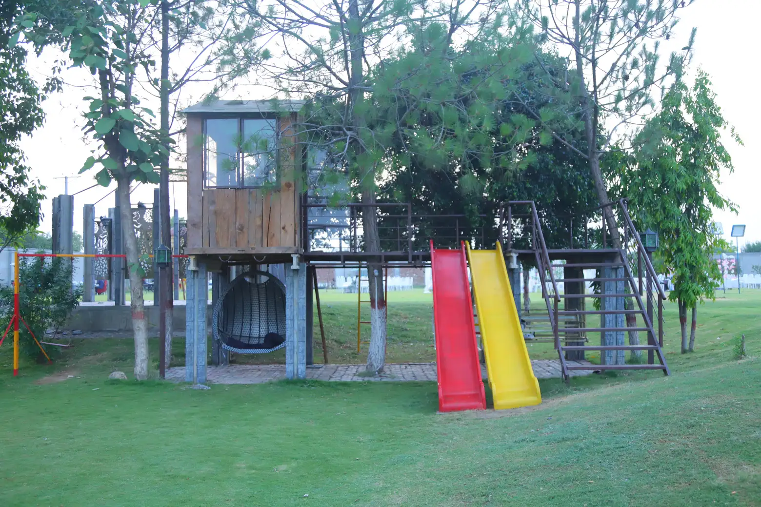Children play area viewed from a lower angle across the garden