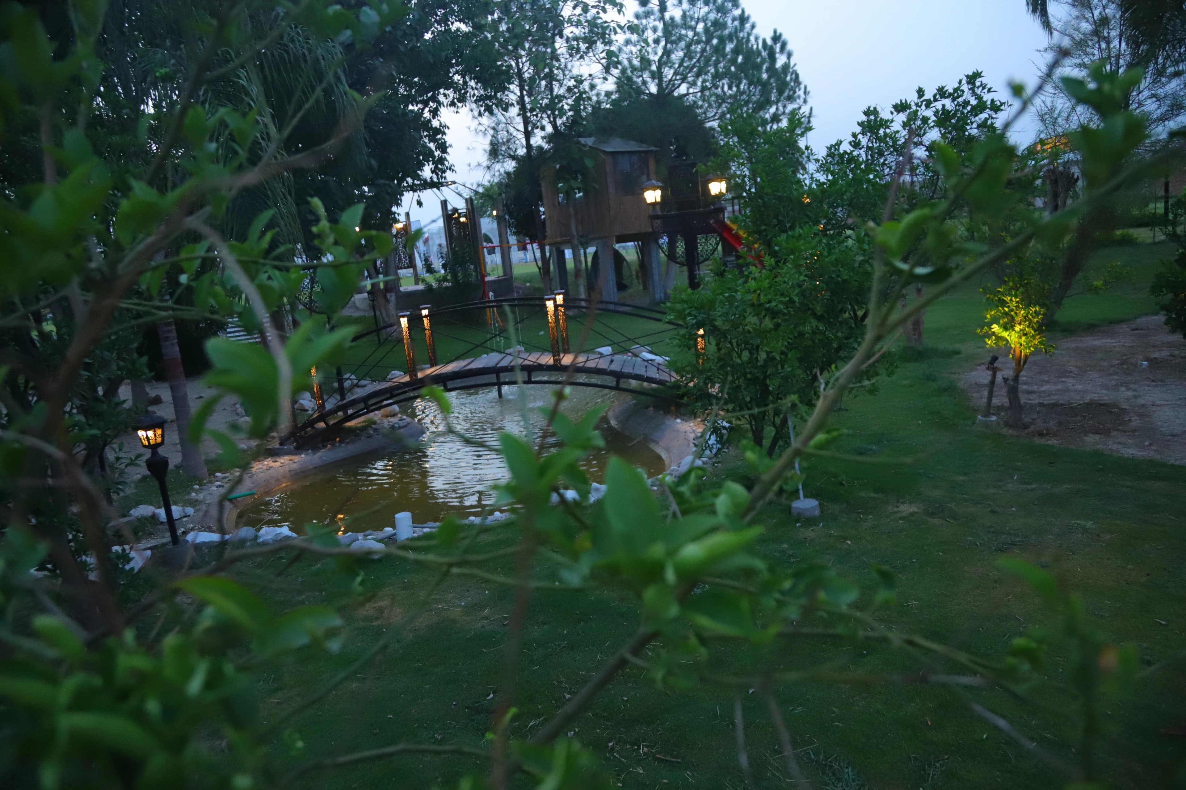 Decorative hanging lanterns beside the bridge at Green Meadows Farm