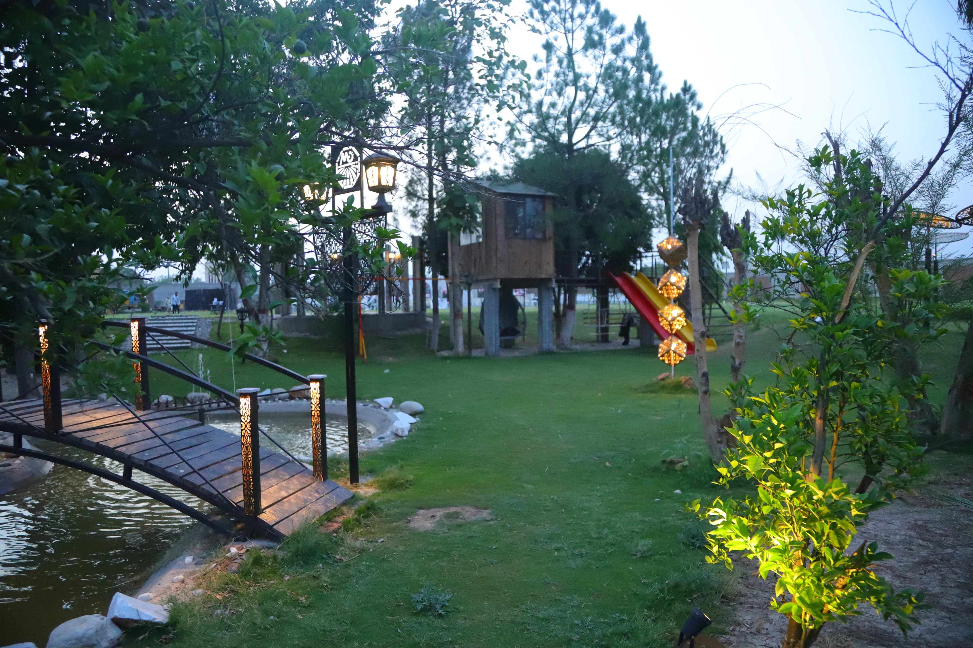 Decorative lantern installation and lawn at dusk for couple photography