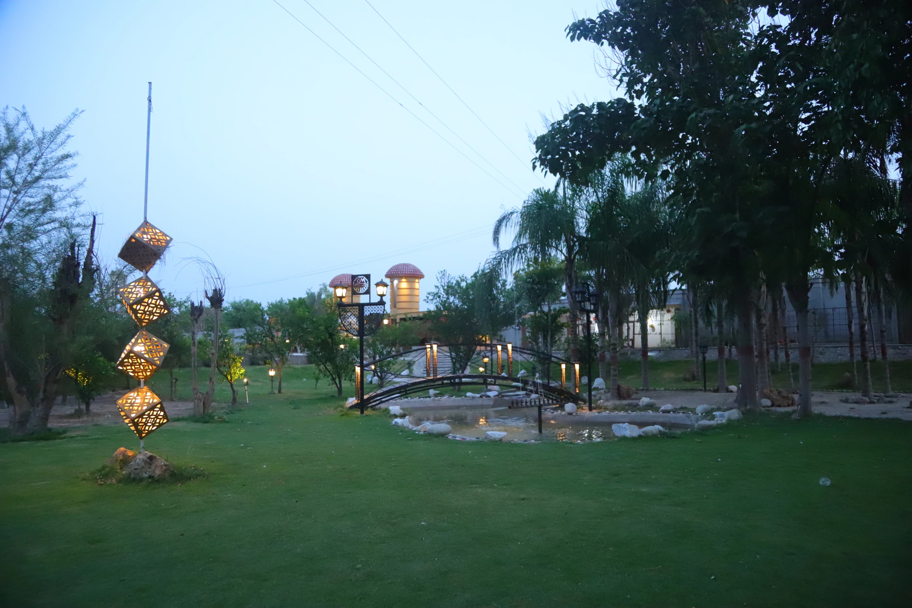 Open lawn beside the bridge and lantern feature for couple shoot sessions