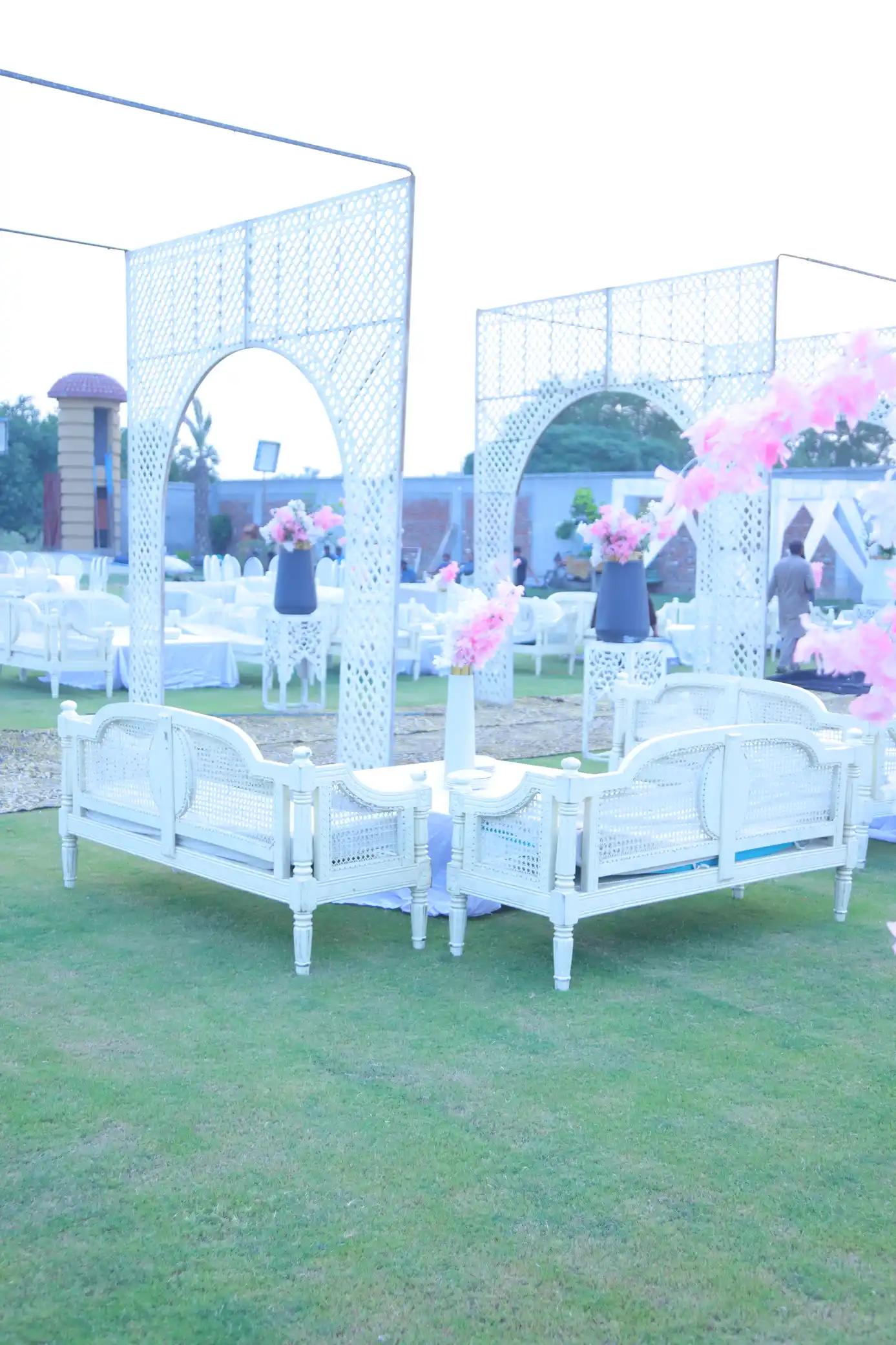 Vertical photo of event seating and decor on the lawn