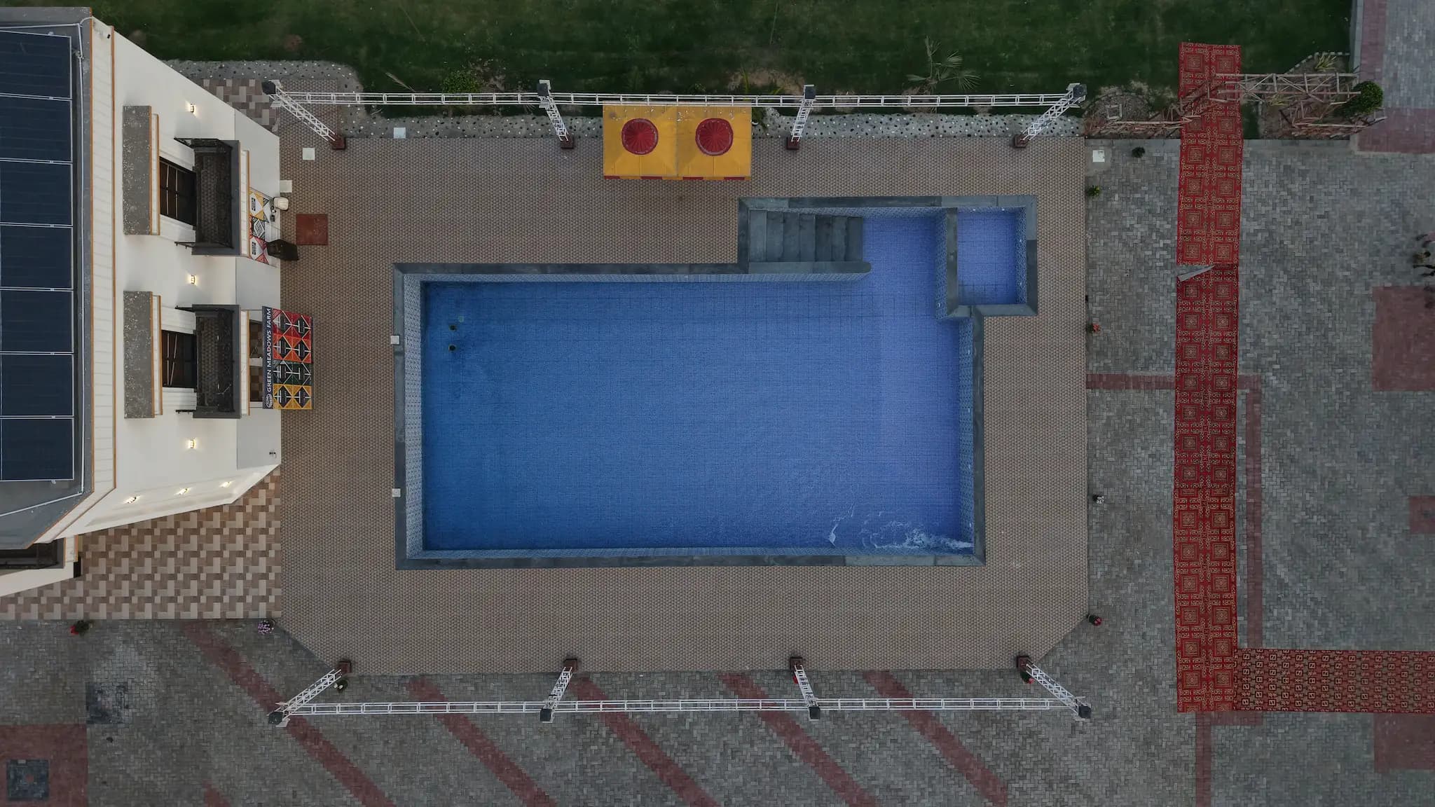 Pool side view showing the deck and surrounding event area