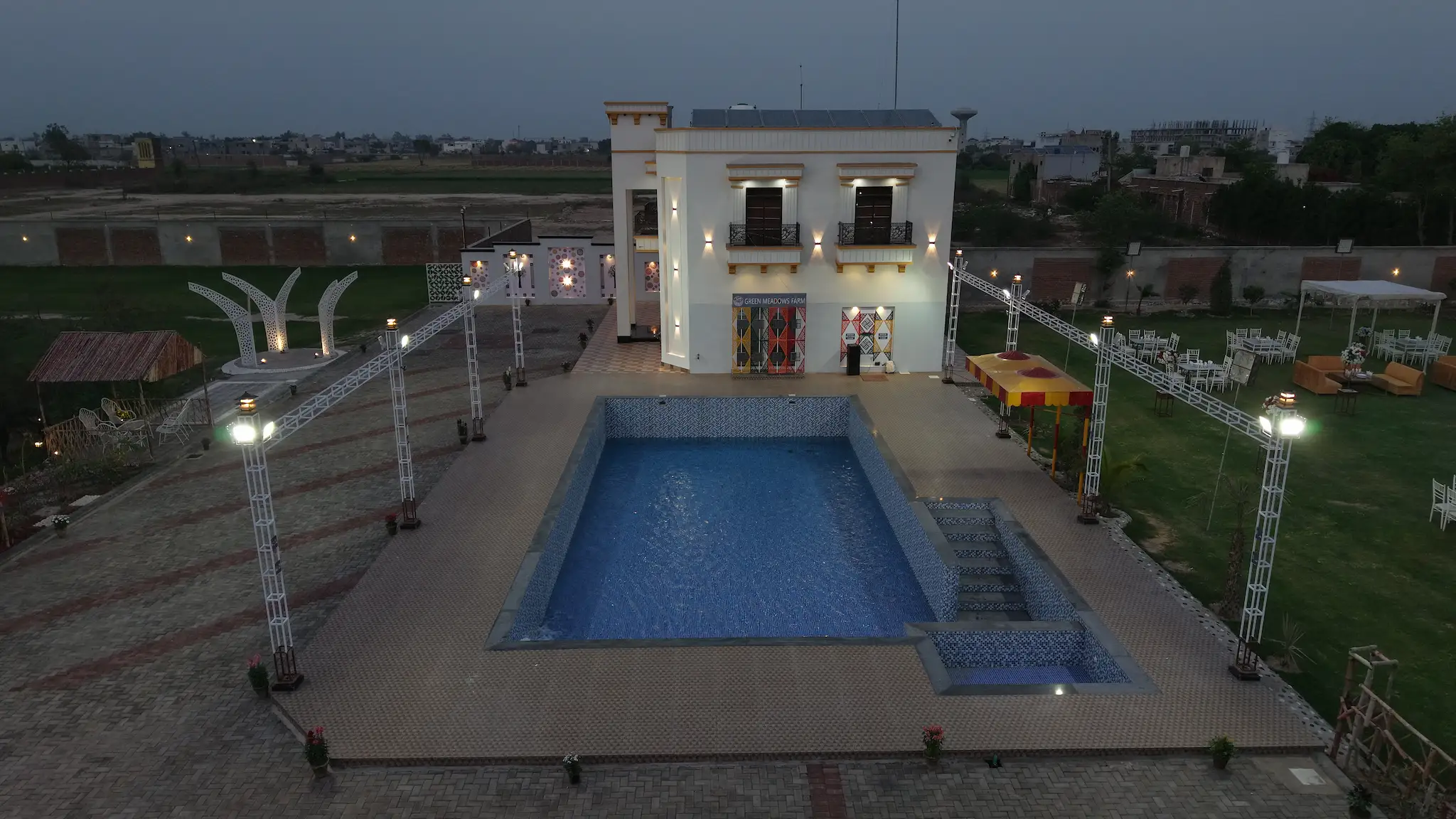 Evening aerial of the pool side zone at Green Meadows Farm